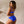 Laden Sie das Bild in den Galerie-Viewer, Frau im blauen Bikini mit Kunstdruck von schräg hinten