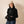 Laden Sie das Bild in den Galerie-Viewer, Frau mit schwarzem Hoodie mit Uhraufduck von vorne