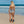 Laden Sie das Bild in den Galerie-Viewer, Frau von Hinten im schwarz weissen Badeanzug mit Kunstdruck Muster April Zebra am Strand